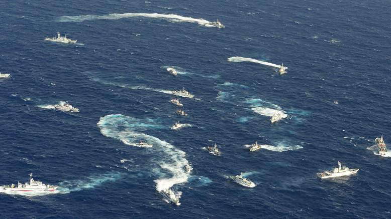 Fishing boats from Japan, Taiwan and mainland China regularly visit the waters surrounding the disputed, in an effort to underline their respective home country's claim on the islands and their waters. Here we see a complex skirmish between numerous fishing boats, and almost as many maritime patrol boats (this is most likely Chinese fishing boats being herded by Japanese patrol boats).