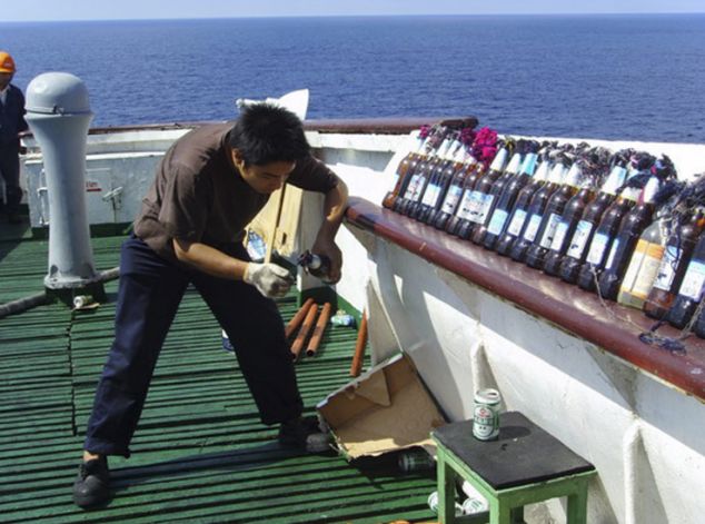 The crew of the Chinese Zhenhua 4 showed uncommon bravery and resourcefulness when it improvised anti-piracy defenses to protect itself while transiting the Gulf of Aden. It used Molotov cocktails, beer bottles and water cannons to defend themselves against Somali pirates who boarded the ship in December of 2008 (here we see one of the crew members lighting one of the firebombs). Nine pirates armed with rocket launchers and AK-47s forced the 30 multinational crew members to lock themselves in their accommodation area. No injuries or deaths were reported. The ordeal ended with the arrival of military helicopters and a warship despatched by the task force fighting the piracy menace in the region. The intrepid defense of their ship earned the crew praiseworthy headlines back home and they were welcomed as heroes when they regained China.
