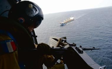 Somali pirates remain active, even though reported incidents are down sharply since mid-2102. Part of that is due to under-reporting of piracy both by armed guards protecting merchant vessels (when they use their weapons to warn off suspicious boats, they increasingly opt not to report the incident, so as to avoid any potential liability), as well as by shipowners (who in the hypercompetive market where too many ships are chasing too few charters, fear having news of one of their ships being targeted by pirates lead to potential or actual clients to shun them). Here we see a French military man operating a machinegun from a helicopter on patrol over sea lanes near Somalia. The continued presence of warships, helicopters and even unmanned reconnaissance aerial vehicles is needed. 